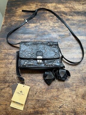 Patricia Nash Lanza Black Tooled Leather Crossbody Bag with rosette tassels
